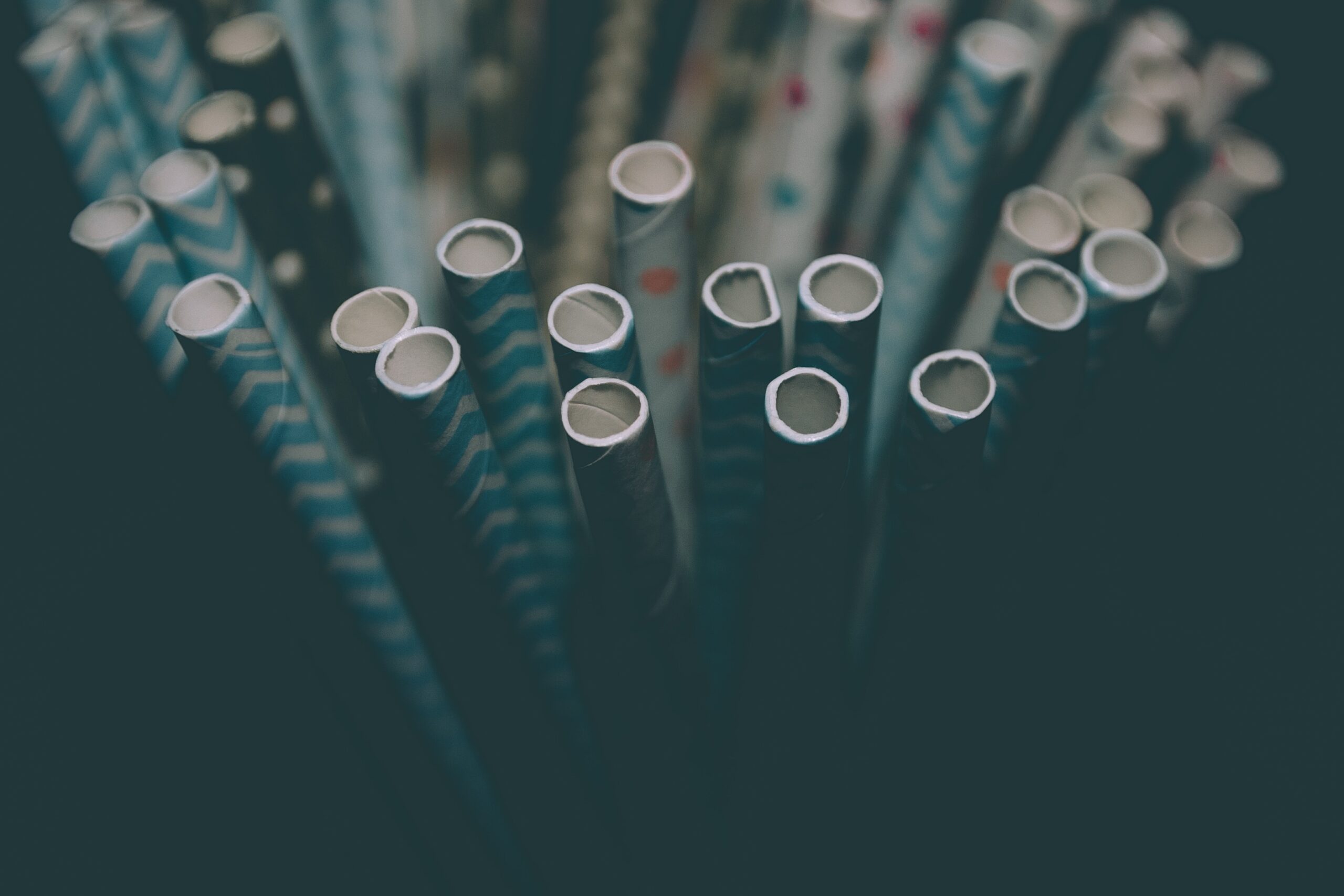Paper straws with blue stripes and slightly mushy looking texture