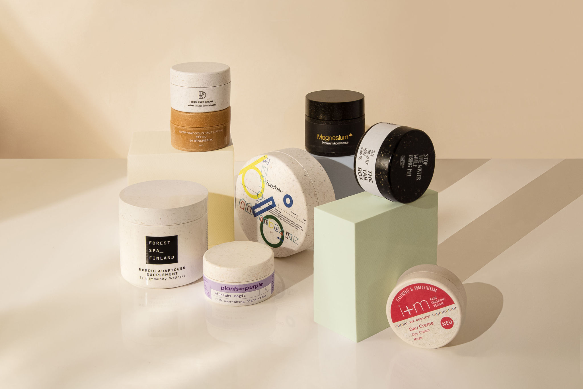 Still life image of cosmetic jars made of Sulapac labeled with different techniques